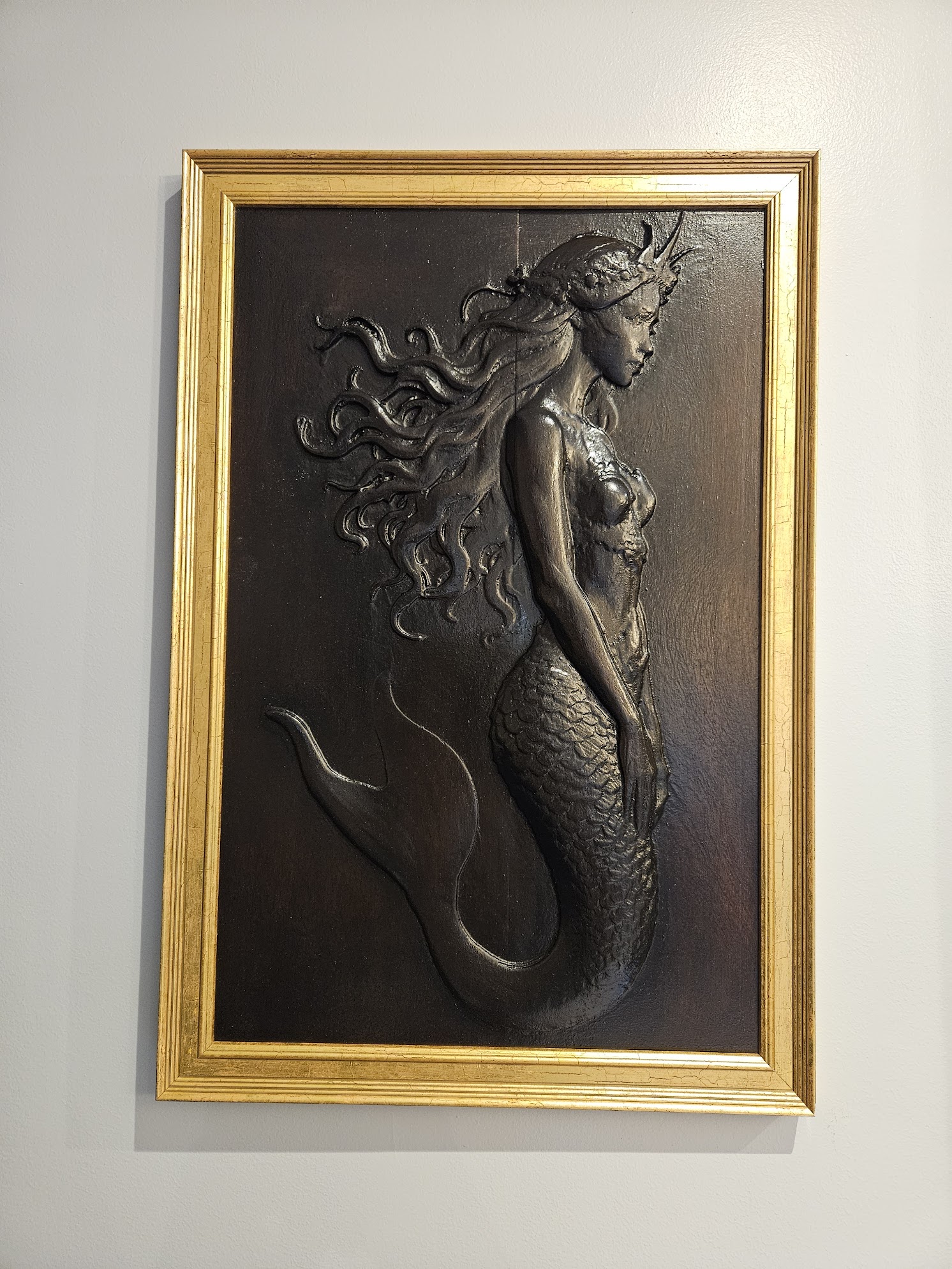 Mermaid in the deep ocean. Carved from laminated Sapele. Stained in dark Jacobean oak colour and finished with Danish oil.